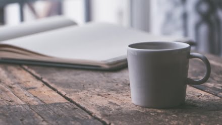 mug of tea with sweetener