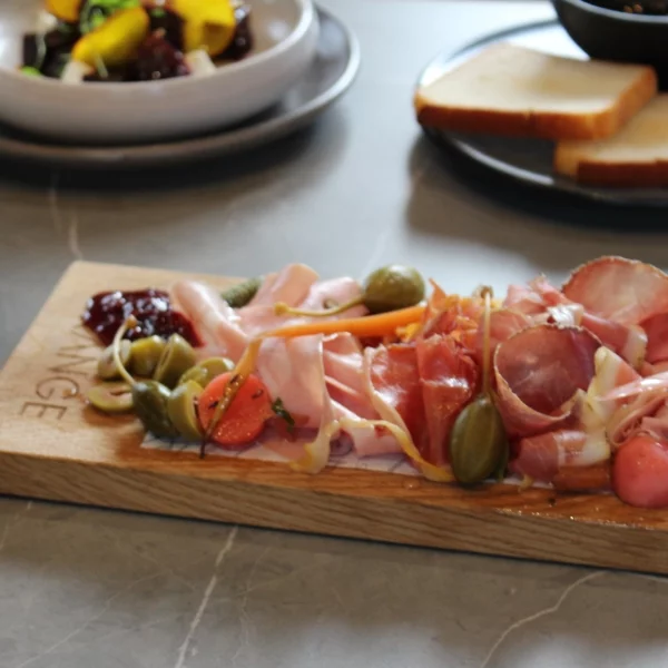 sliced vegetables on wooden chopping board