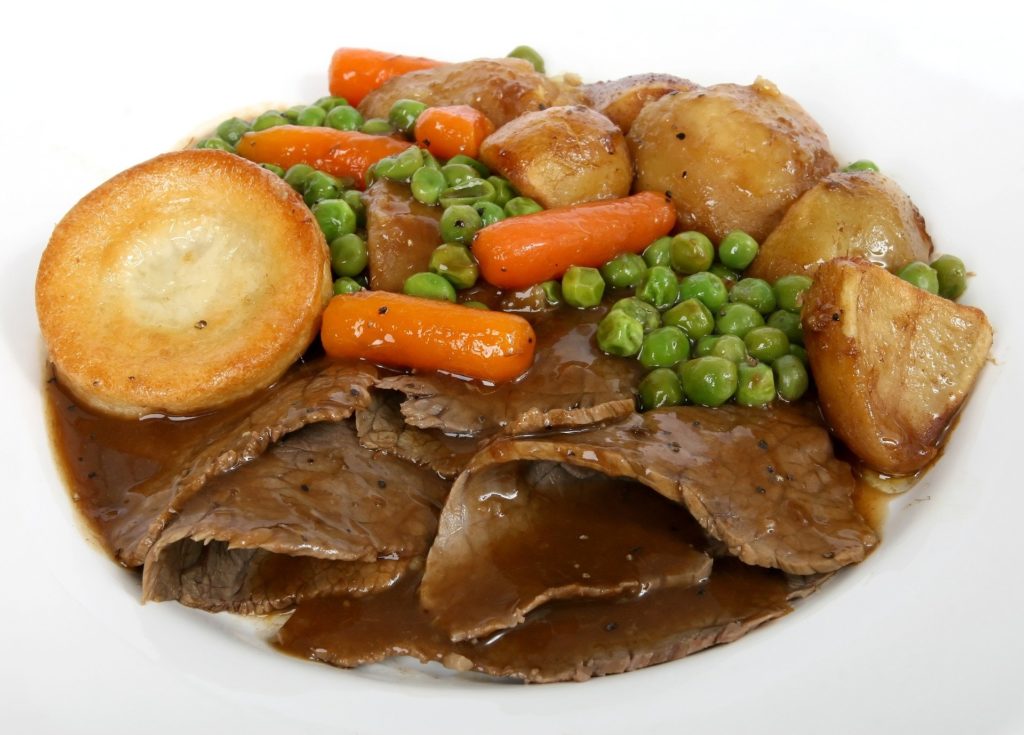 Traditional beef roast dinner with Yorkshire puddings