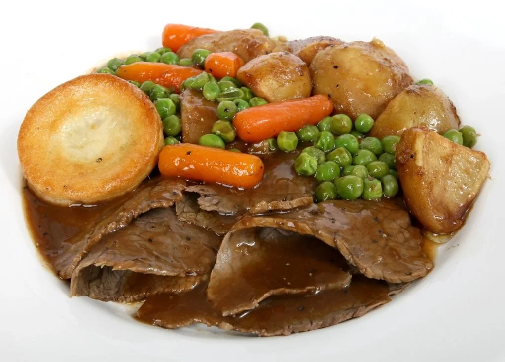 Traditional beef roast dinner with Yorkshire puddings