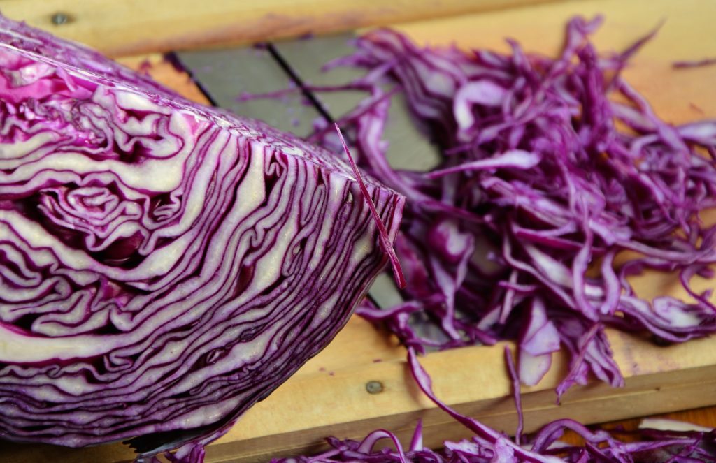 Red cabbage, raw on chopping board