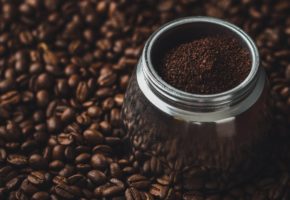 ground coffee on beans